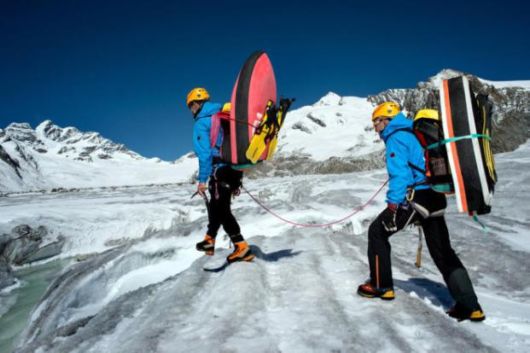 Two Guys Go Hydrospeeding Through A Glacier In Switzerland