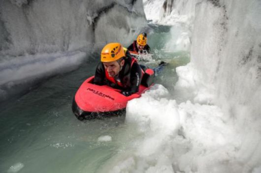 Two Guys Go Hydrospeeding Through A Glacier In Switzerland